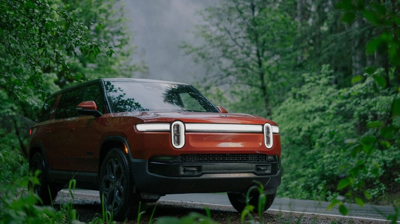 Red Rivian R1S parked at roadside