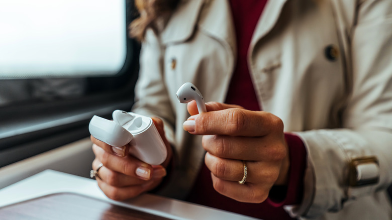 Woman using Apple AirPods