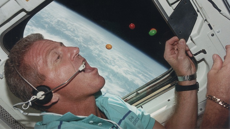 Astronaut eating floating candy