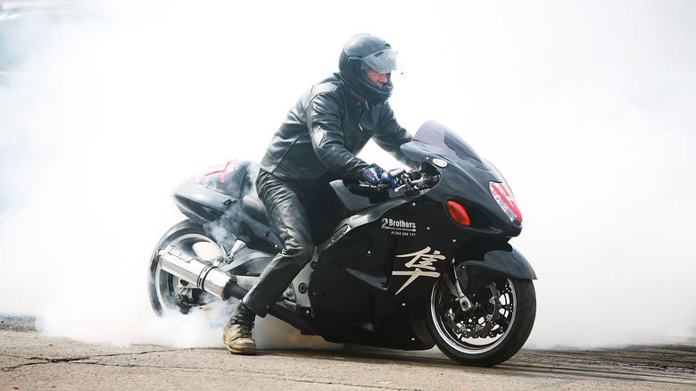 Man performs a burnout on his Suzuki Hayabusa motorcycle