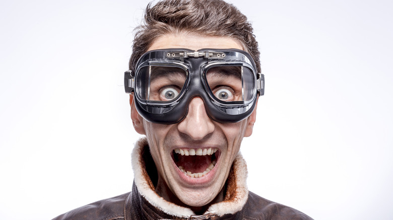 man aviator goggles smiling