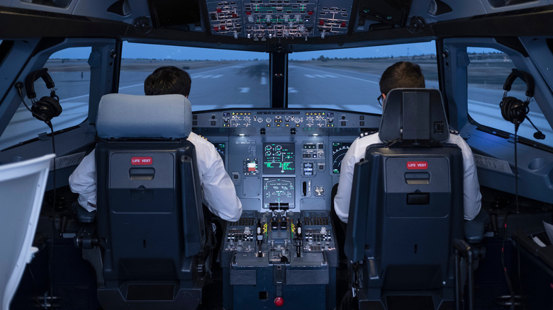 Pilots in flight simulator