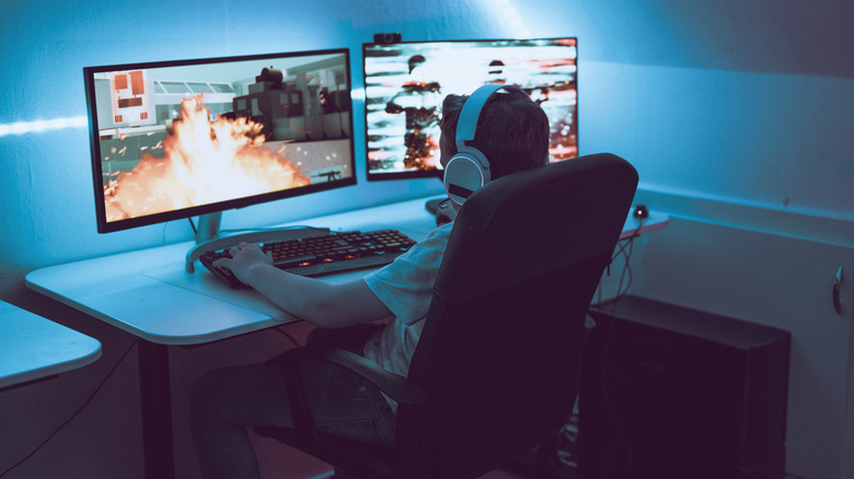 child playing video games on PC