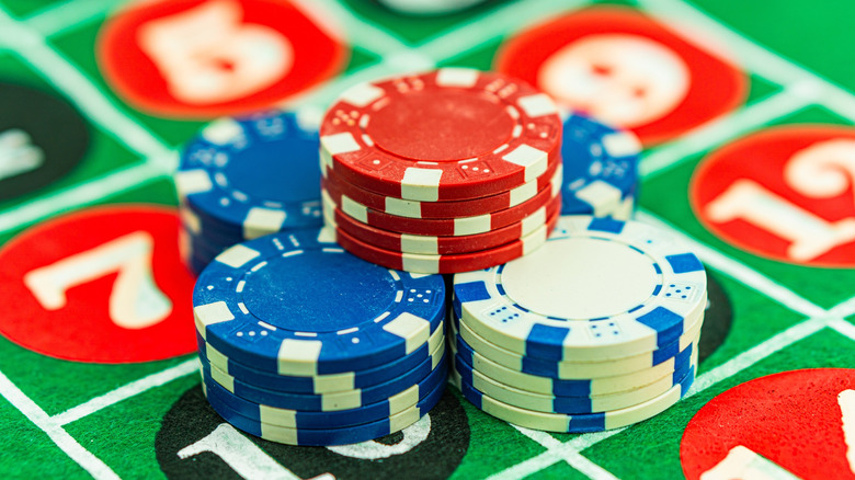 Poker chips on roulette table