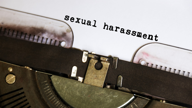 Typewriter with paper that says sexual harassment