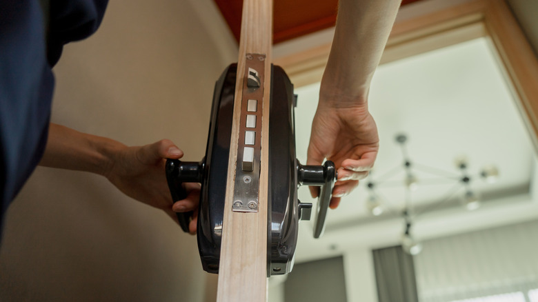 Person installing a smart lock