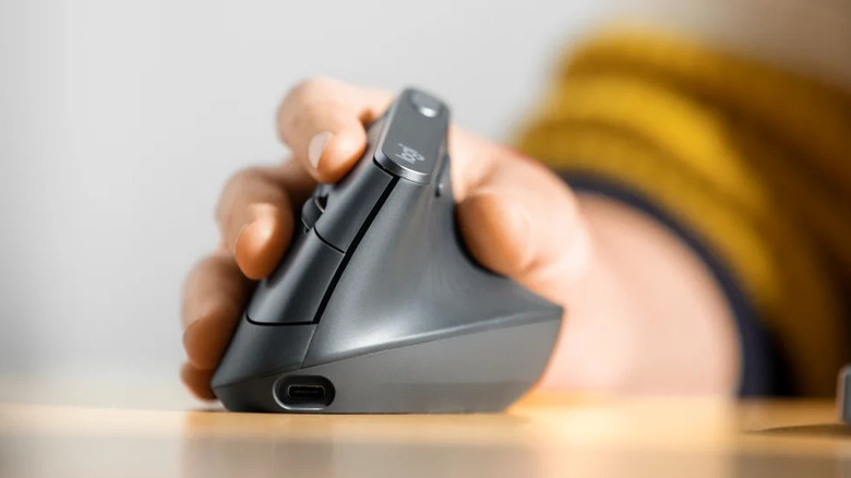 Closeup of a hand on a Logitech ergonomic mouse