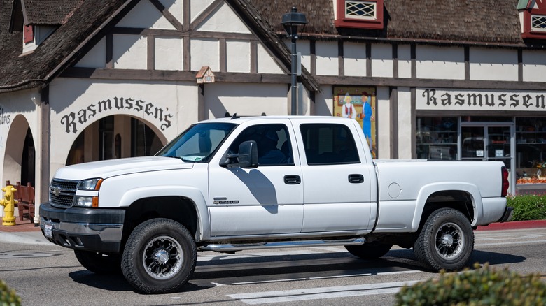 А GMT800 Silverado HD in white, front 3/4 view