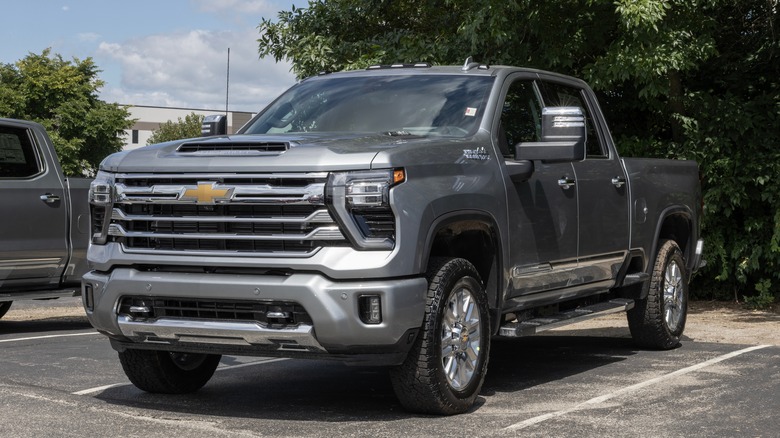 A 2024 Silverado HD in gray, front 3/4 view