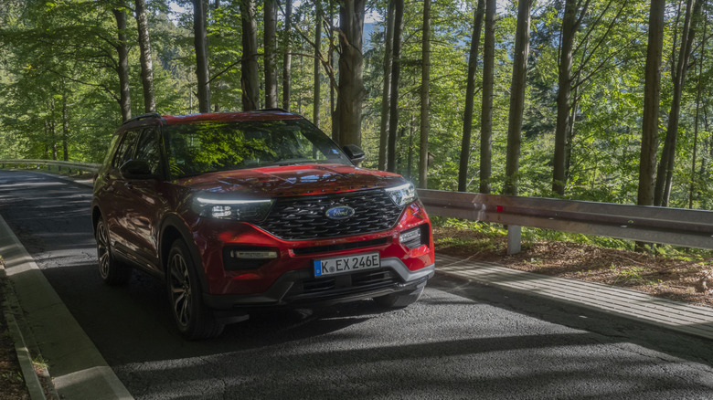 Red Ford Explorer in the forest