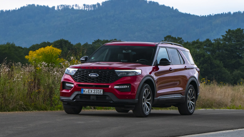 Red Ford Explorer among nature