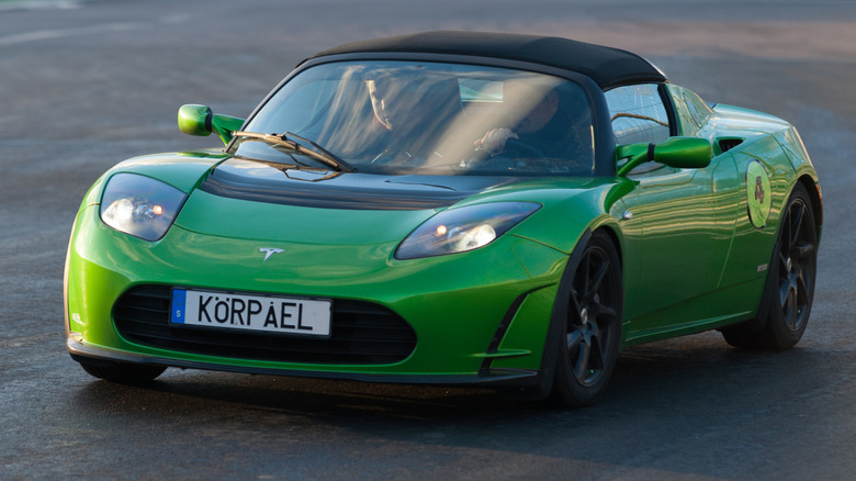 A green Tesla Roadster on a racecourse in Sweden