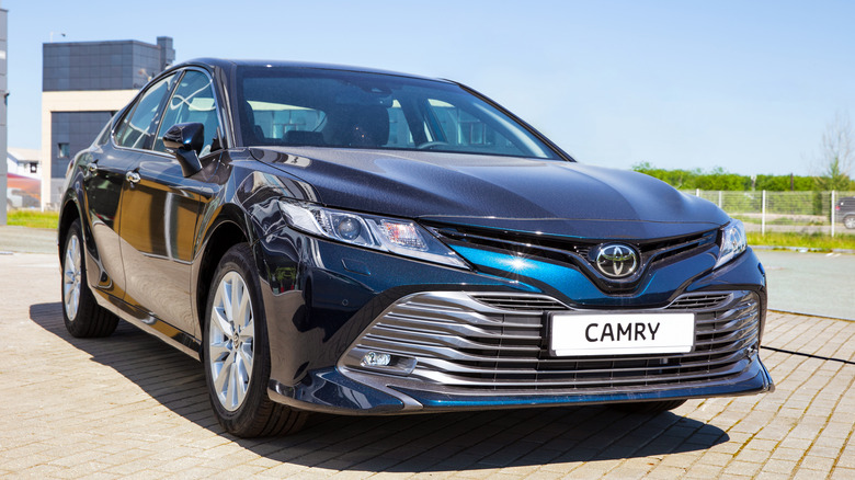 Blue Toyota Camry parked on street