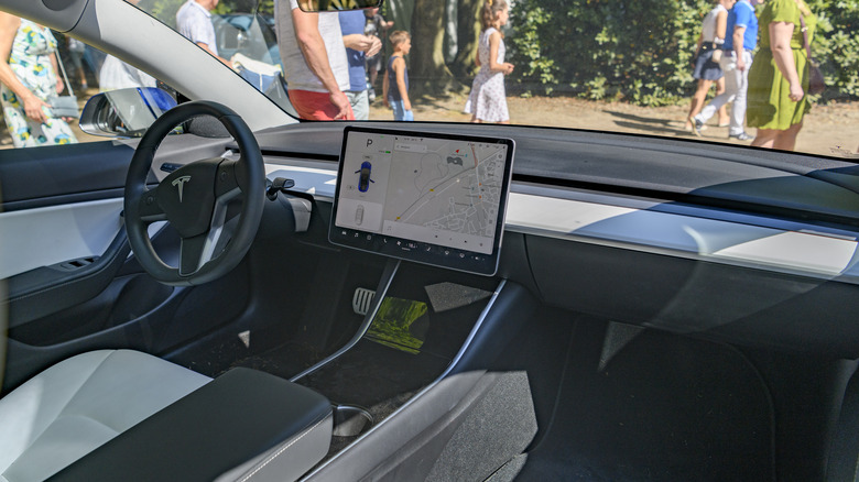 Tesla model 3 interior with touchscreen and dashboard