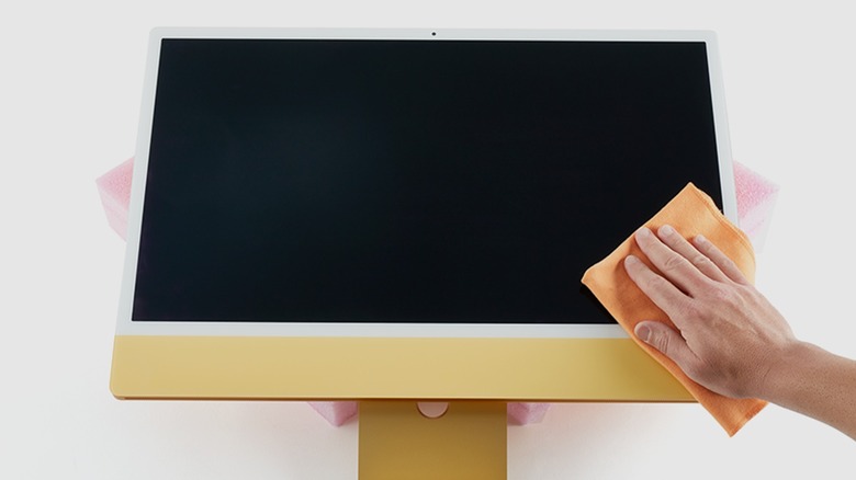 iMac repaired display being cleaned