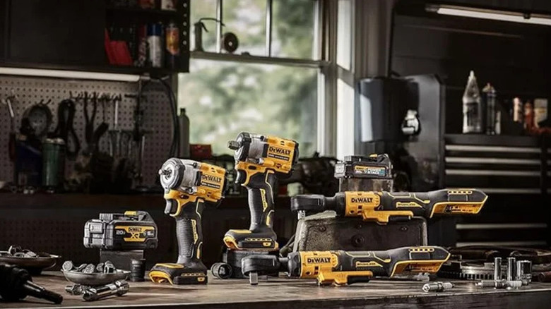 A selection of power tools from Dewalt on a work bench