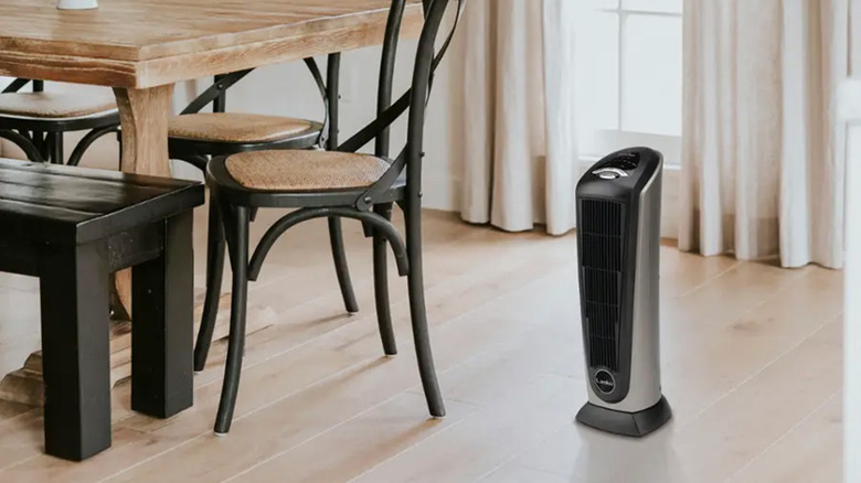 A Lasko portable heater next to a dining room table