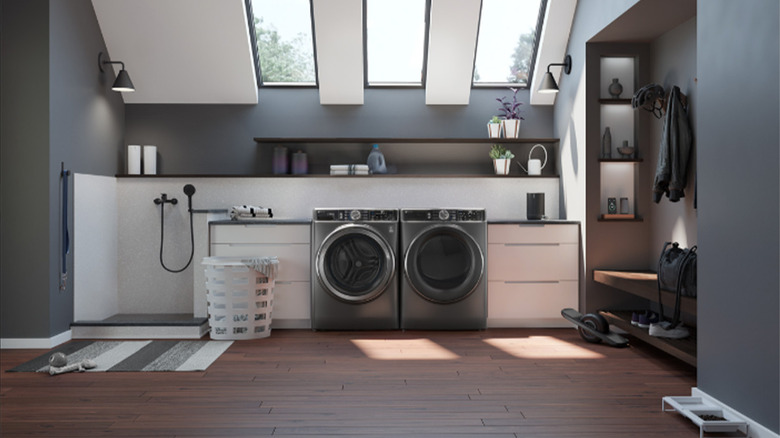 A GE washer and dryer combo in a laundry room