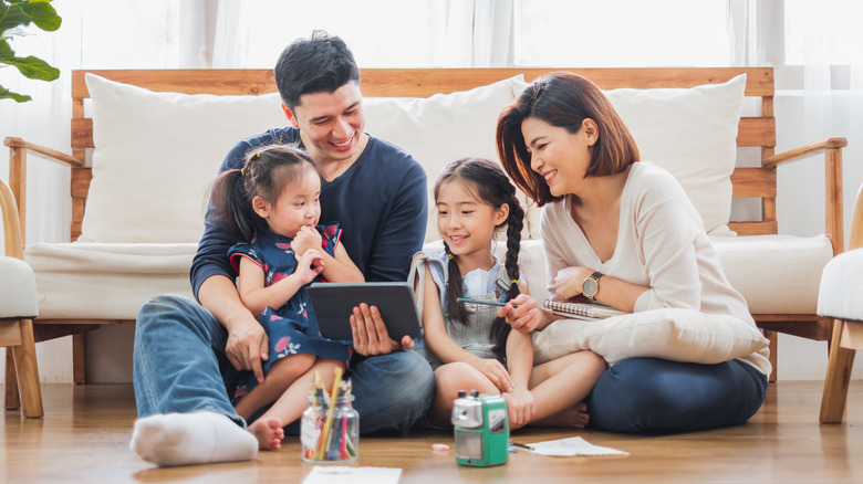 Family looking at a tablet