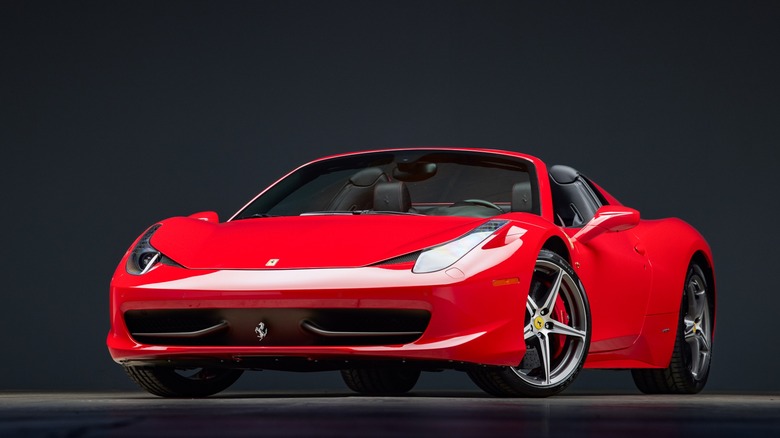 The Ferrari 458 Spider in Rosso Corsa red, front 3/4 view