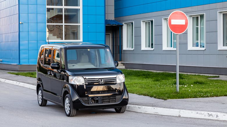 A Honda N-BOX in black, front 3/4 view