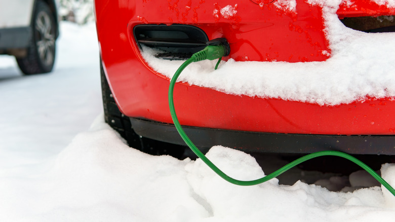 Block heater cable plugged into car in the snow