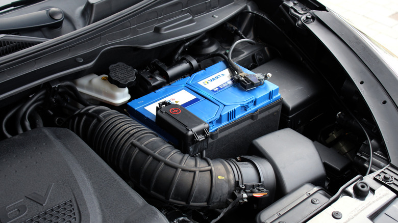 Battery under hood of car