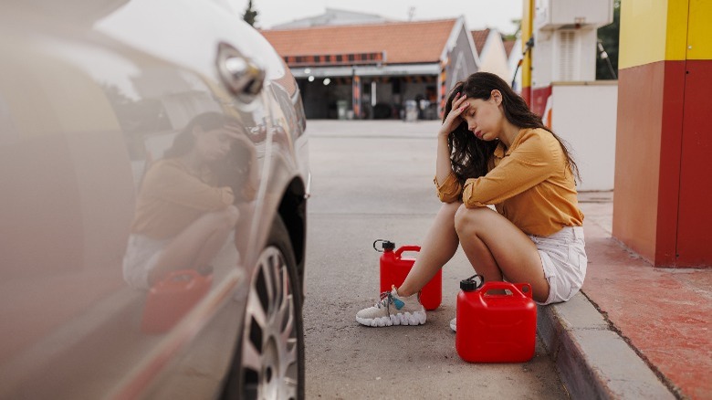 woman at a gas station