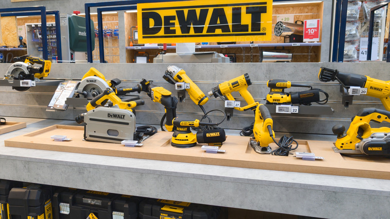 DeWalt logo brand and text sign interior store display yellow electric cordless power tools