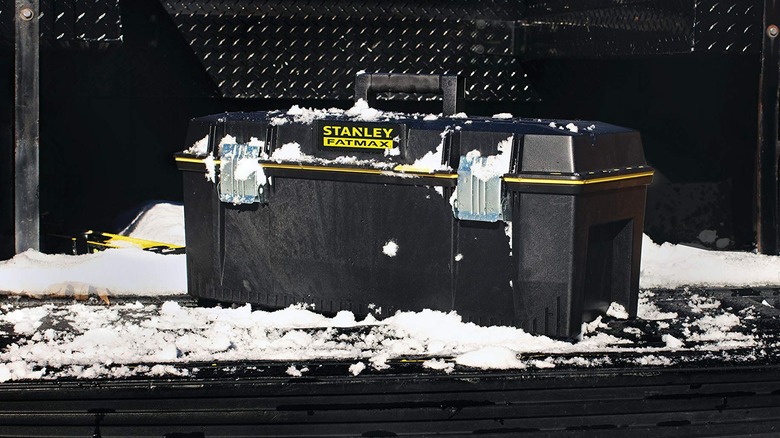 Stanley - 28 in. 9.2 Gallon Mobile Tool Box covered in snow in the bed of a truck