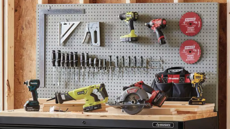 A variety of tools are featured on a work bench.