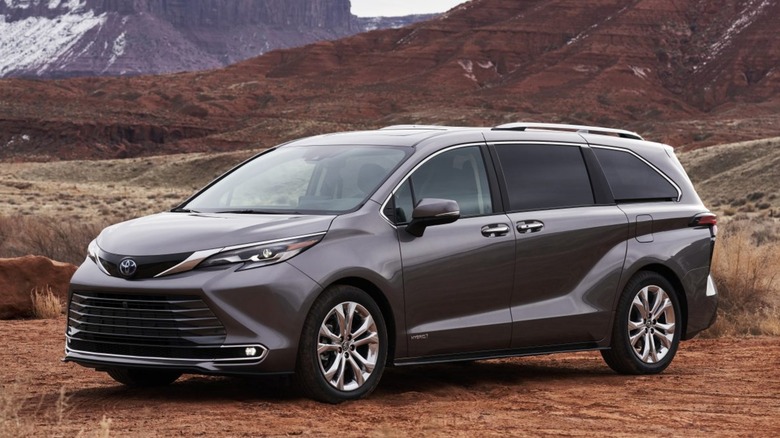 Grey Toyota Sienna parked in mountainous terrain