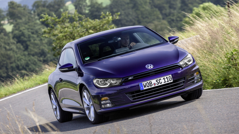 Blue Volkswagen Scirocco R cornering at speed