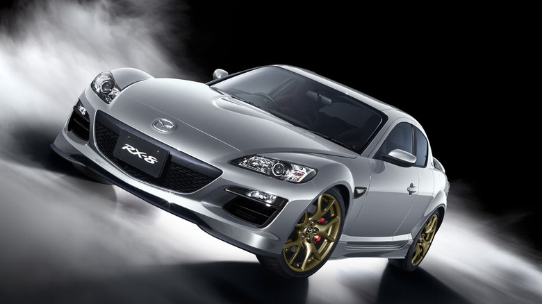 Greay Mazda RX-8 with gold wheels