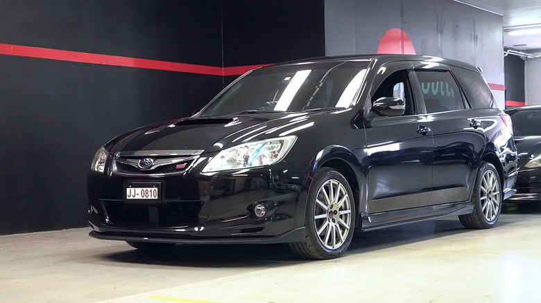 Black Subaru EXIGA 2.0 HT minivan