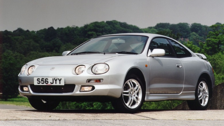 White Toyota Celica sixth-gen with round headlights