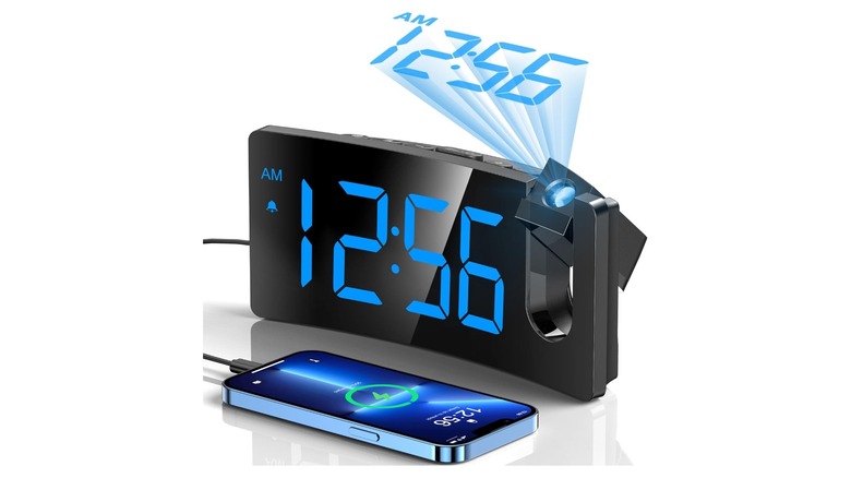 Curved black alarm clock with bright blue numerical display