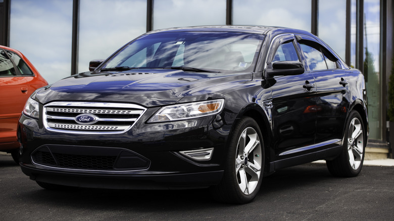 A Ford Taurus SHO in black, front 3/4 view