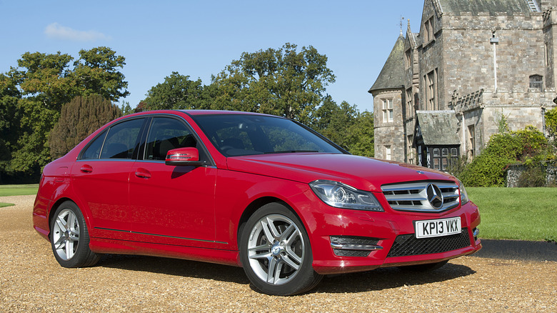 A W204 Mercedes C350 facelift in red, front 3/4 view