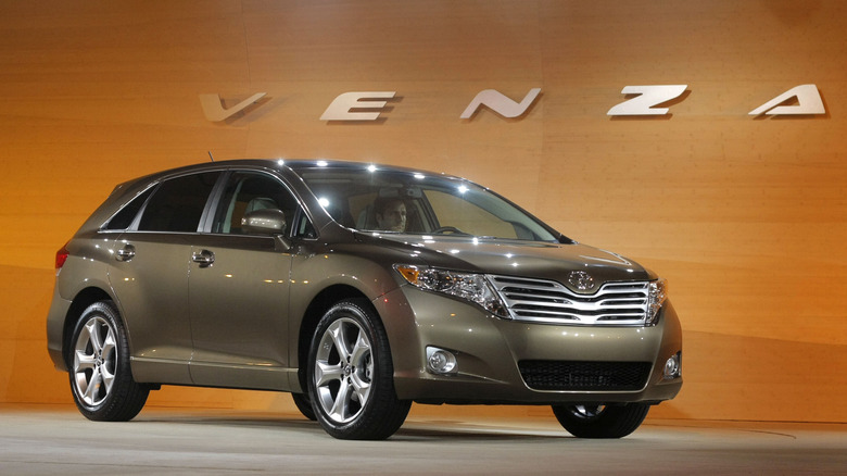 The Toyota Venza in brown at an auto show, front 3/4 view