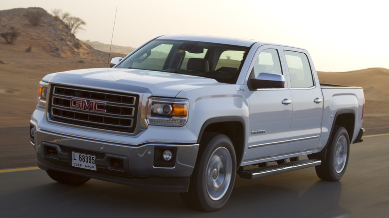 White 2014 GMC Sierra on the road