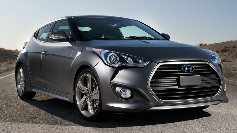 Gray 2013 Hyundai Veloster parked