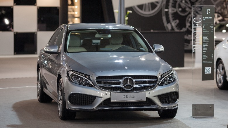 a grey Mercedez-Benz coupe in a showroom