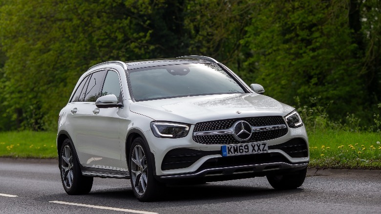 a white Mercedes-Benz GLC cruising down a road