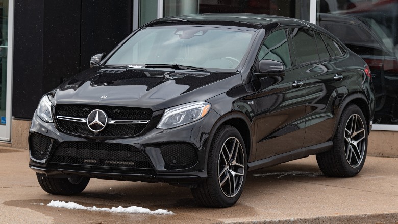 a black Mercedes-Benz GLE in a car dealership