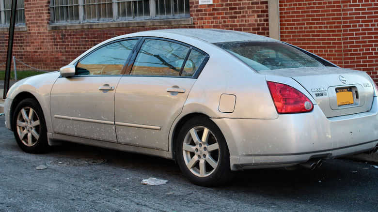 Silver 2004 Nissan Maxima parked