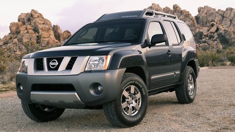 Black 2005 Nissan Xterra on dirt road