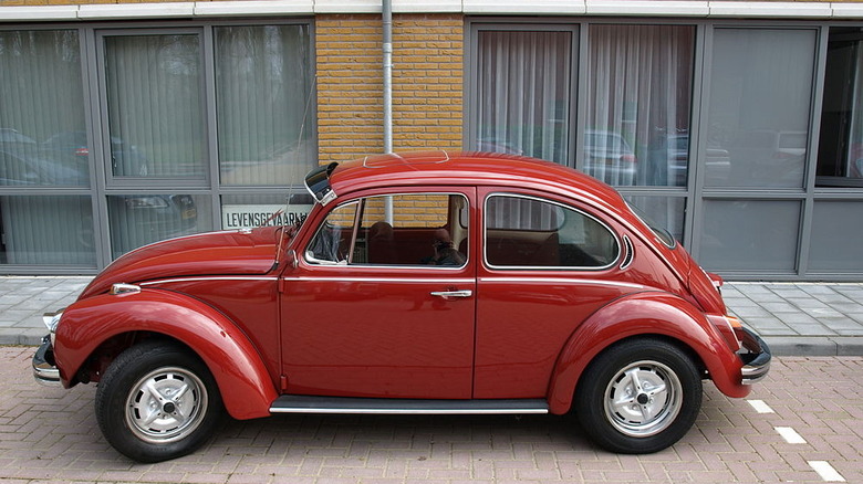 Red 1971 Super Beetle on a street