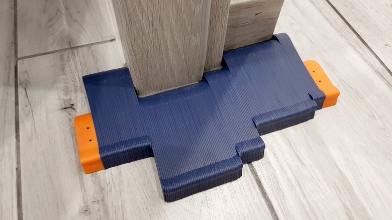 blue contour gauge tool on wood floor