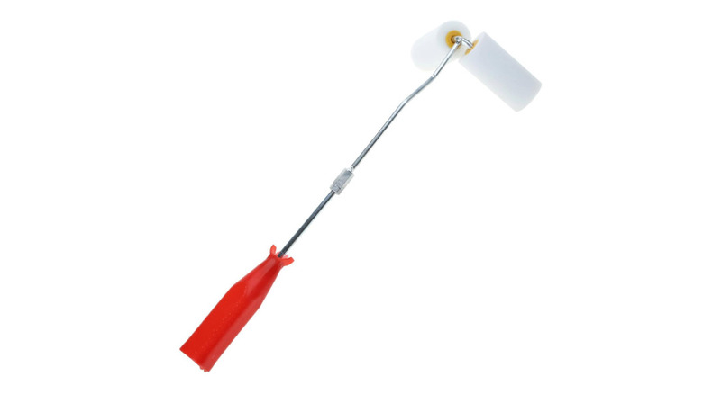 white dual paint roller with orange handle